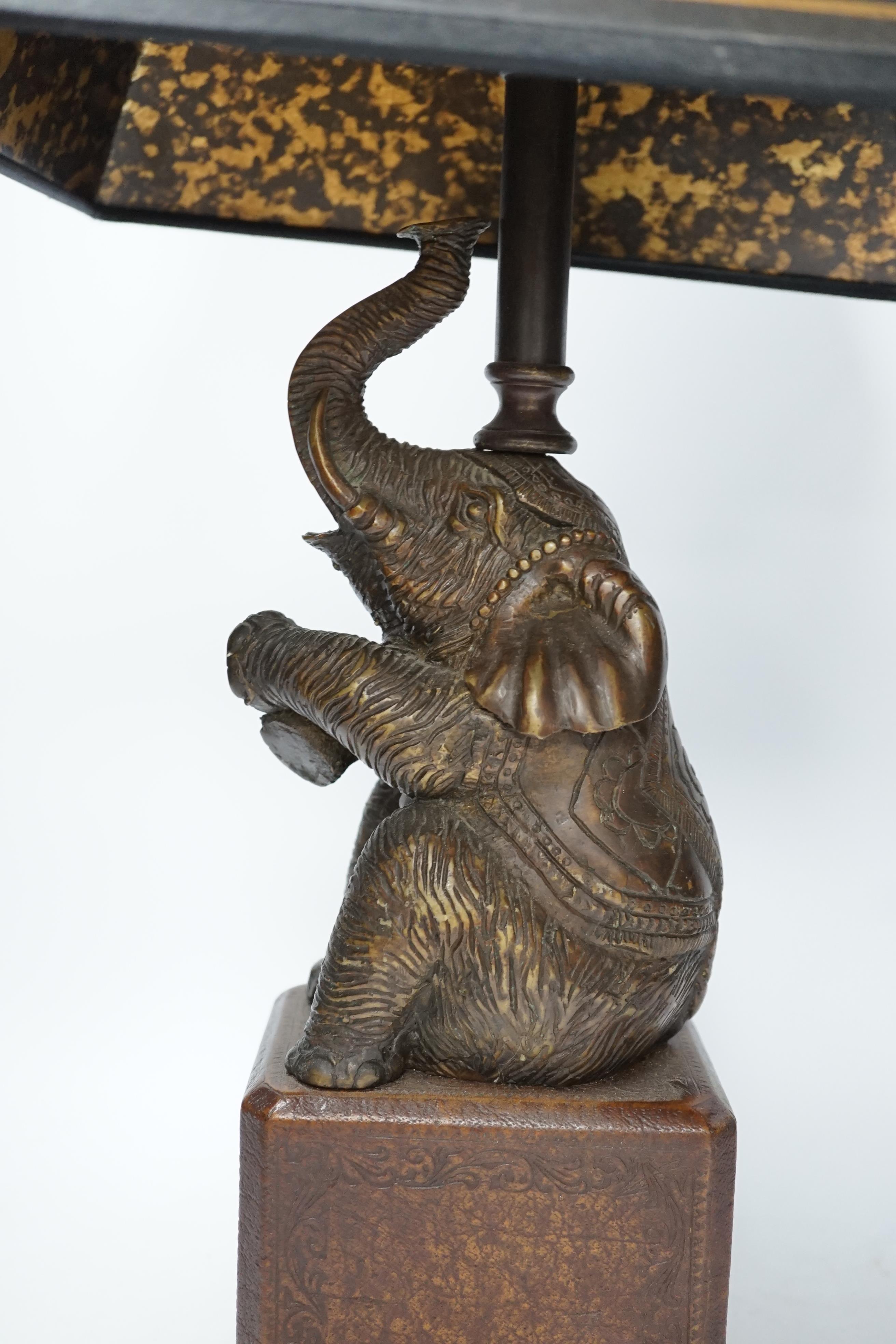 A bronzed elephant table lamp with chinoiserie shade, 65cm high